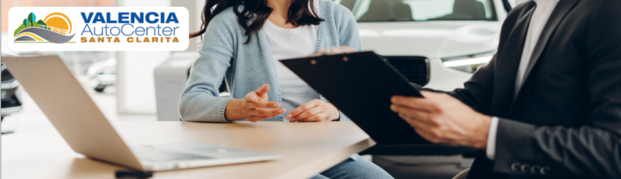 Happy customers exploring pre-owned vehicle deals from top brands at Valencia Auto Center in Santa Clarita.