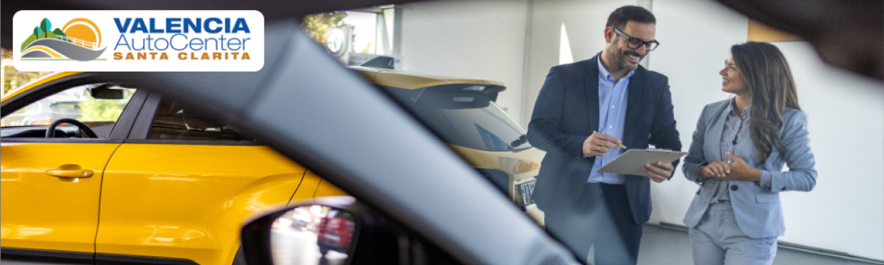  Customer using the car down payment calculator on a laptop at home in Santa Clarita.