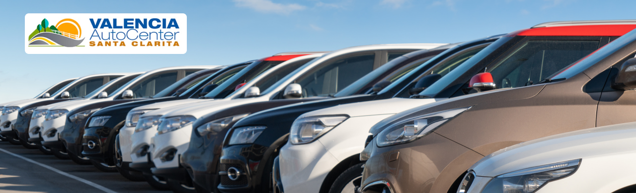Shoppers browsing rows of new and used cars at Valencia Auto Center in Santa Clarita