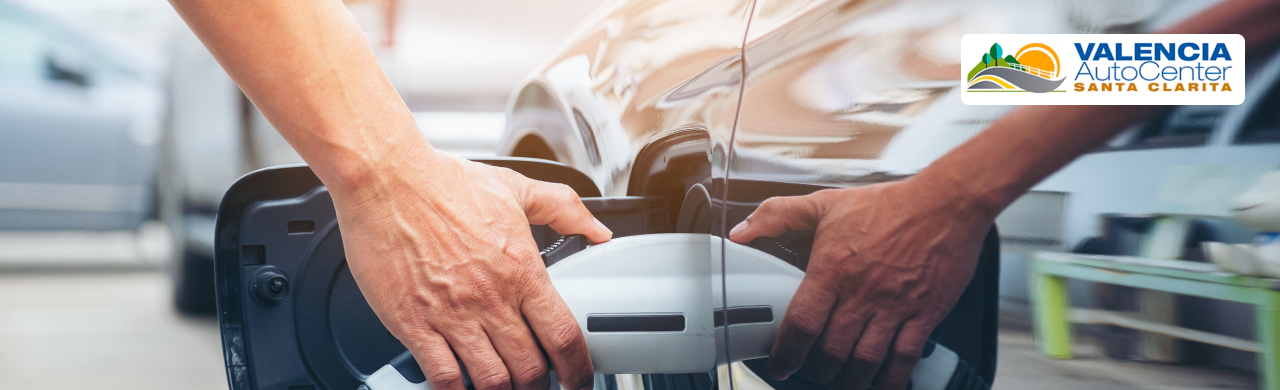 Driver exploring electric truck towing and performance features in Valencia, CA