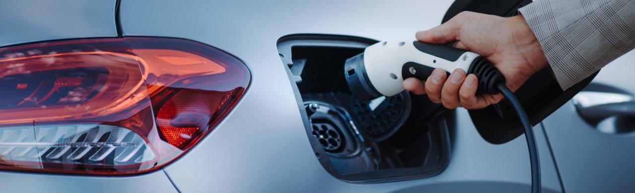  Driver exploring budget EV options at Valencia Auto Center showroom