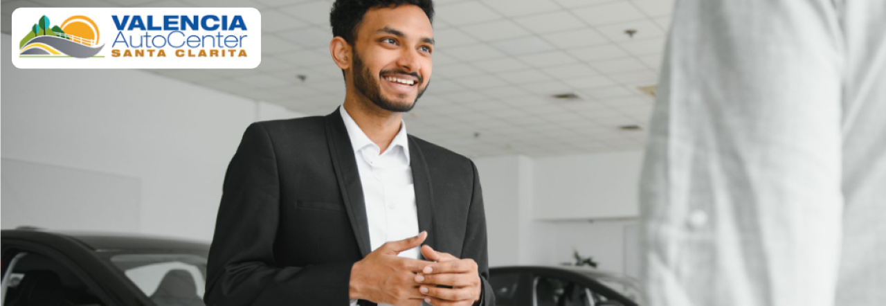 A customer consulting with a knowledgeable sales associate at Valencia Auto Center