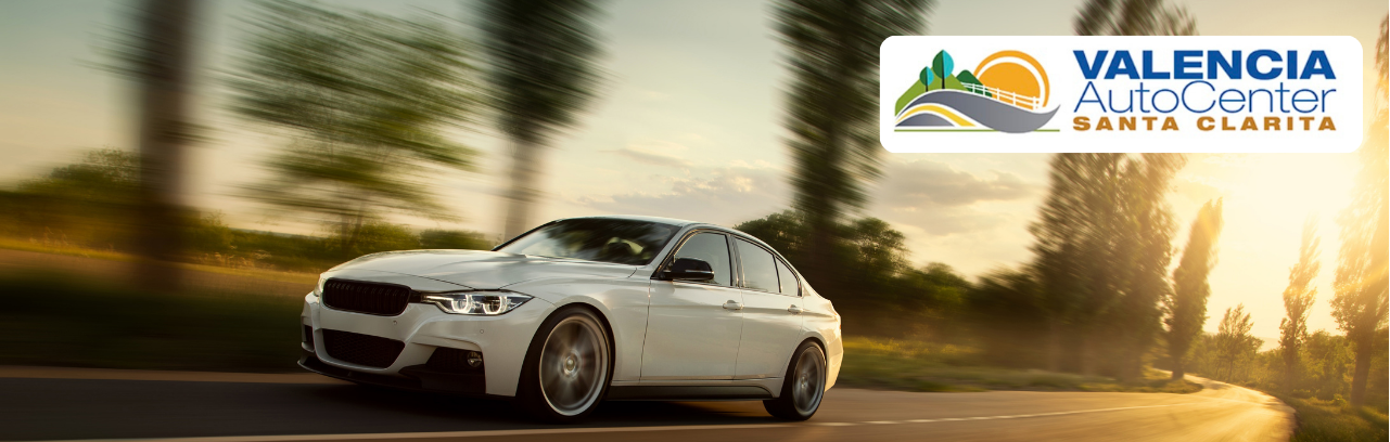 Valencia Auto Center finance team assisting a customer with car financing, Valencia options, and auto loan applications.