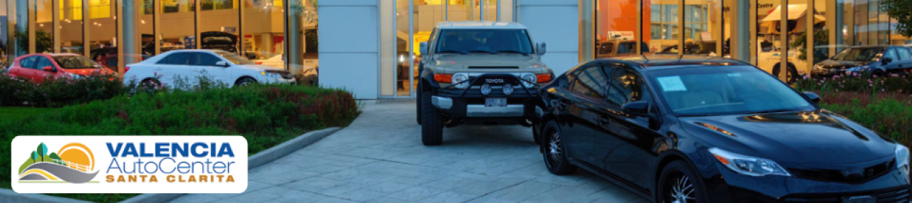  A row of dealerships near Valencia, CA at Valencia Auto Center featuring multiple car brands.
