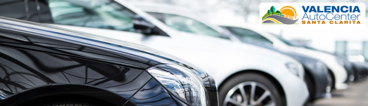 Selection of used cars lined up at Valencia Auto Center near Santa Clarita