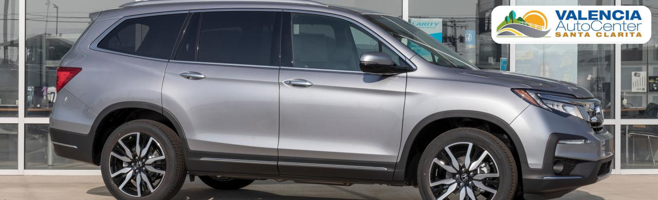 Customer browsing new and pre-owned Honda vehicles at Valencia Auto Center in Valencia, CA
