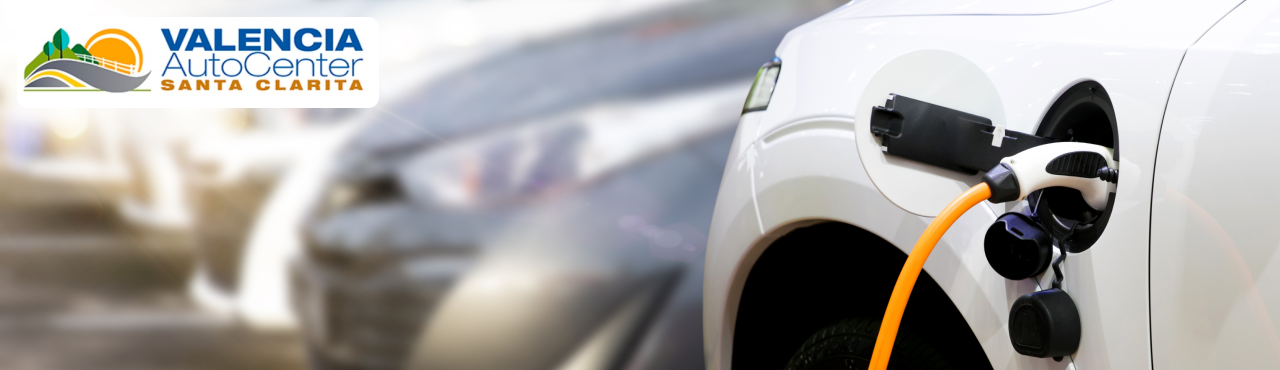 Valencia Auto Center staff explaining EV charger options to a customer in Santa Clarita