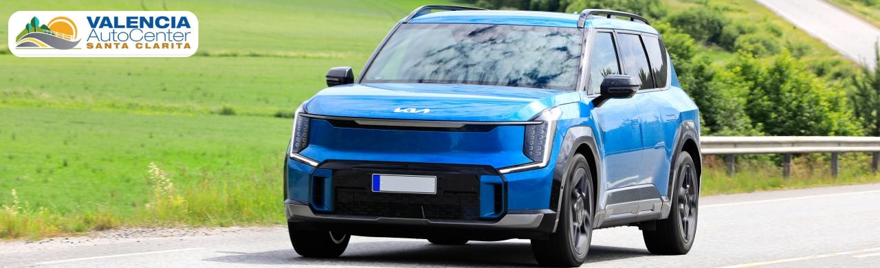 Customer browsing Kia electric cars and hybrids at Valencia Auto Center