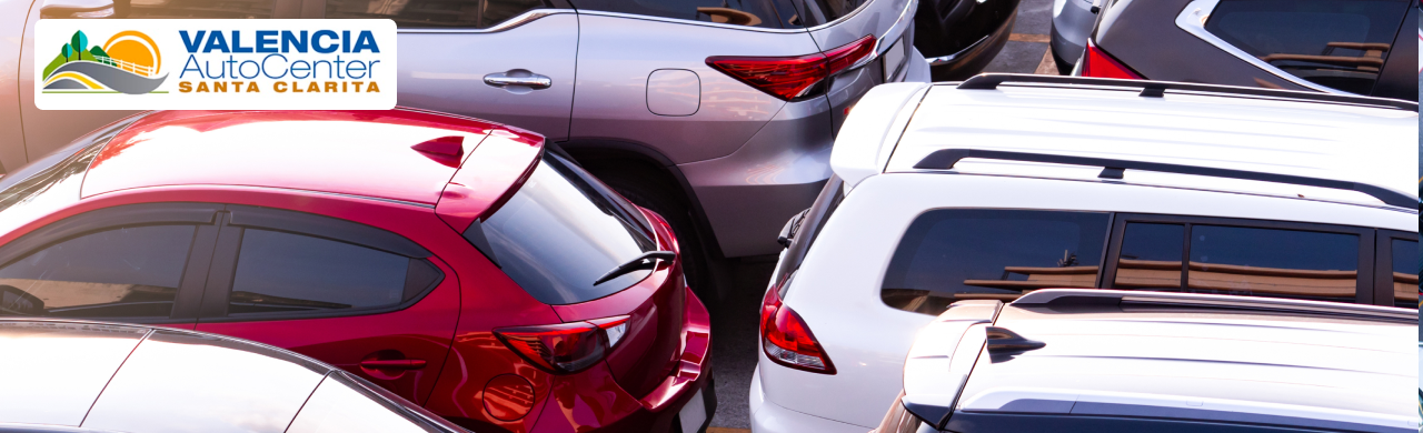 New and used cars lined up at Valencia Auto Center, ready for sale
