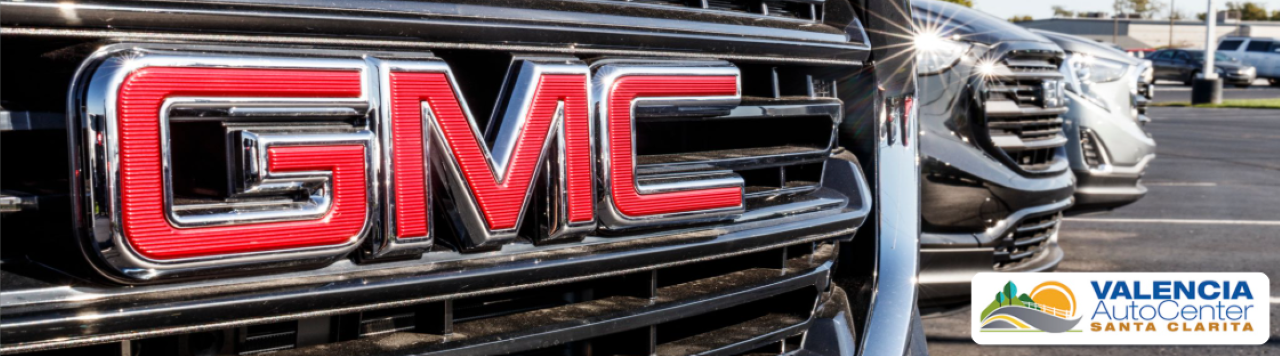New GMC trucks are displayed on the Valencia Auto Center dealership lot in Southern California.