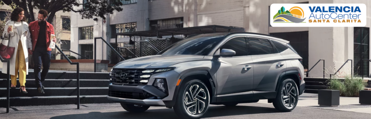 Valencia Auto Center sales representative assisting a customer with Hyundai lease and financing options.