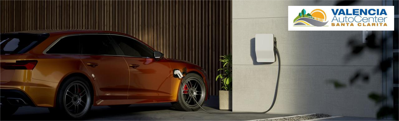 Level 2 electric vehicle home charging station mounted in a residential garage