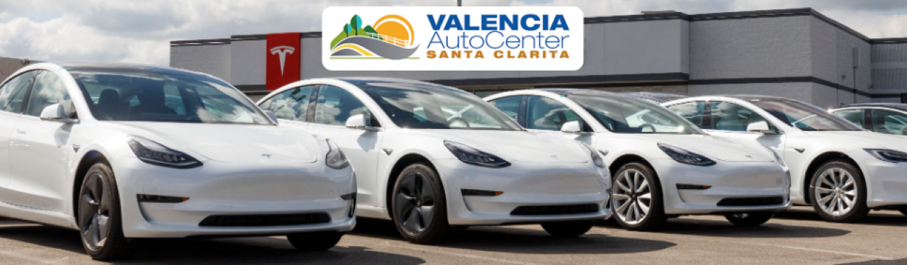 Lineup of 2025 electric vehicles from top EV manufacturers parked at Valencia Auto Center.