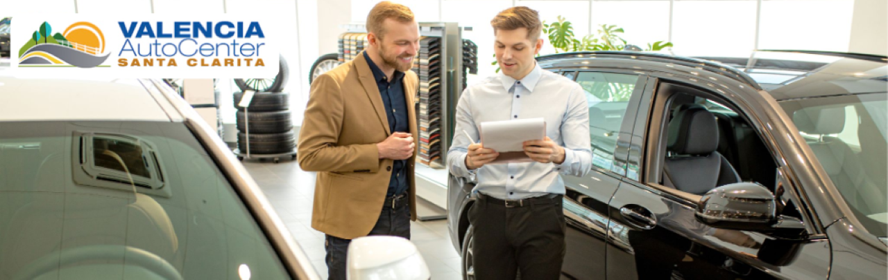 A friendly sales team assists customers at Valencia Auto Center near Valencia, CA.