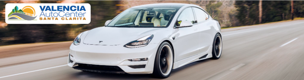 A lineup of 2023 electric cars on display at Valencia Auto Center, showcasing modern design and eco-friendly technology.