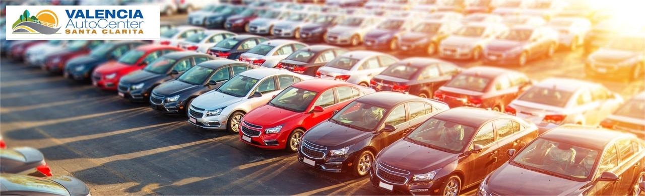 Variety of sedans and SUVs lined up at Valencia Auto Center near Los Angeles