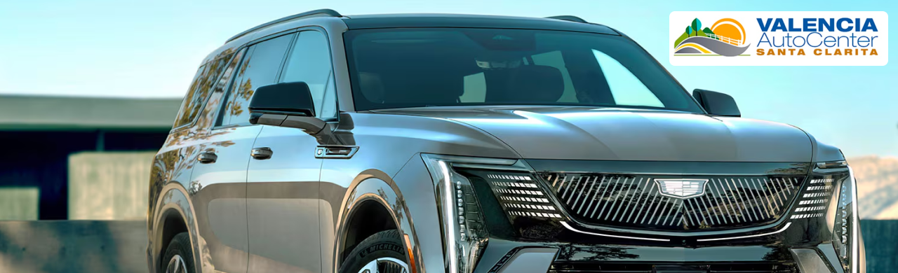 A lineup of used Cadillac cars and SUVs for sale at Valencia Auto Center in Santa Clarita, CA.