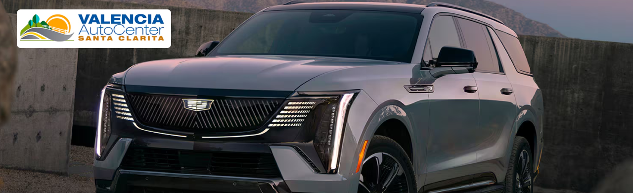 Customer reviewing used Cadillac financing options at Valencia Auto Center in Valencia, CA.
