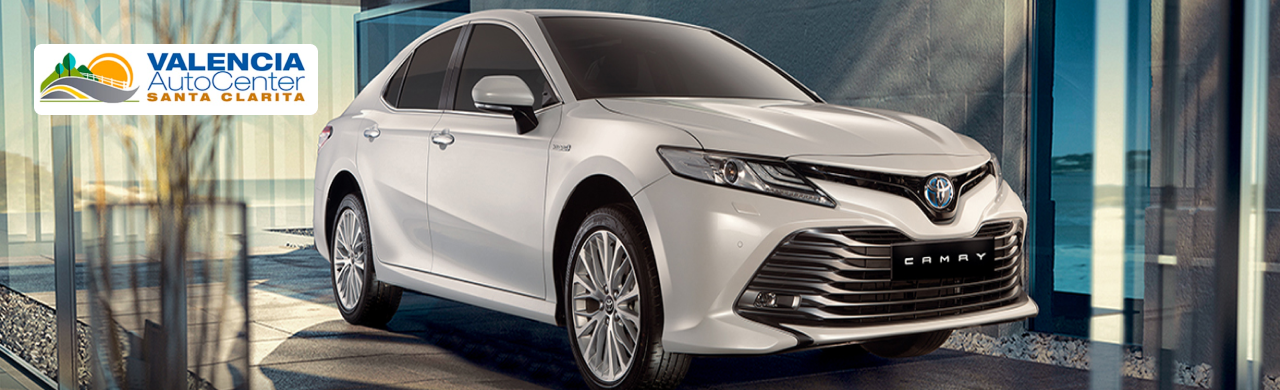 Used Camry Hybrid models lined up at Valencia Auto Center, ready for Santa Clarita drivers