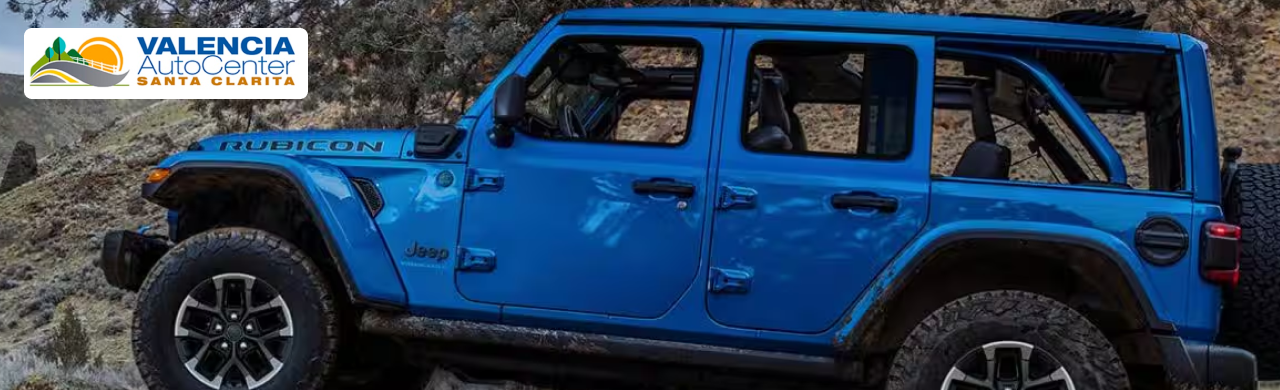 Customer exploring used Jeep SUVs with financing options at Valencia Auto Center showroom