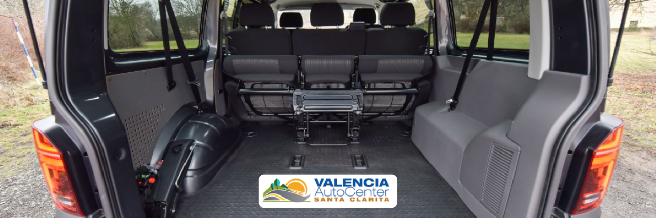 Interior view of a pre-owned minivan showcasing spacious seating and flexible cargo options for family travel.