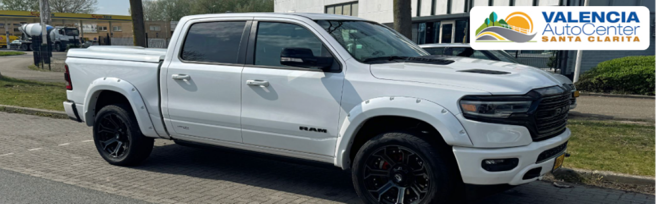 Lineup of used trucks for sale at Valencia Auto Center in Santa Clarita, California