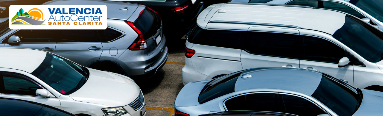 Large row of new and used cars displayed at Valencia Auto Center in Santa Clarita, CA