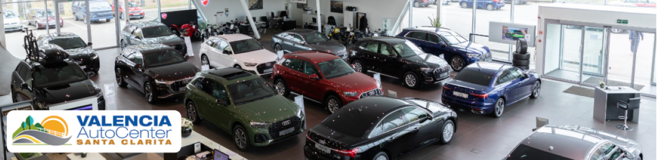 A panoramic view of Valencia Auto Center, showing multiple dealerships within the auto mall along one convenient mile.